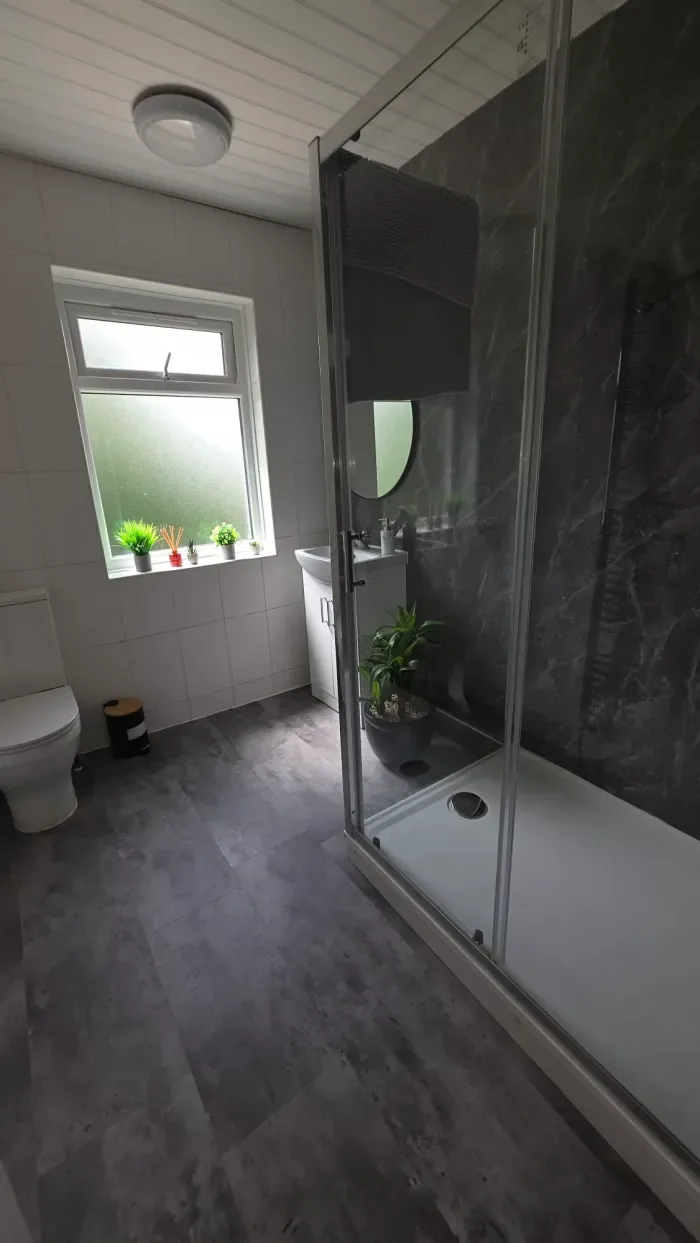 Shower room cleaned throughout