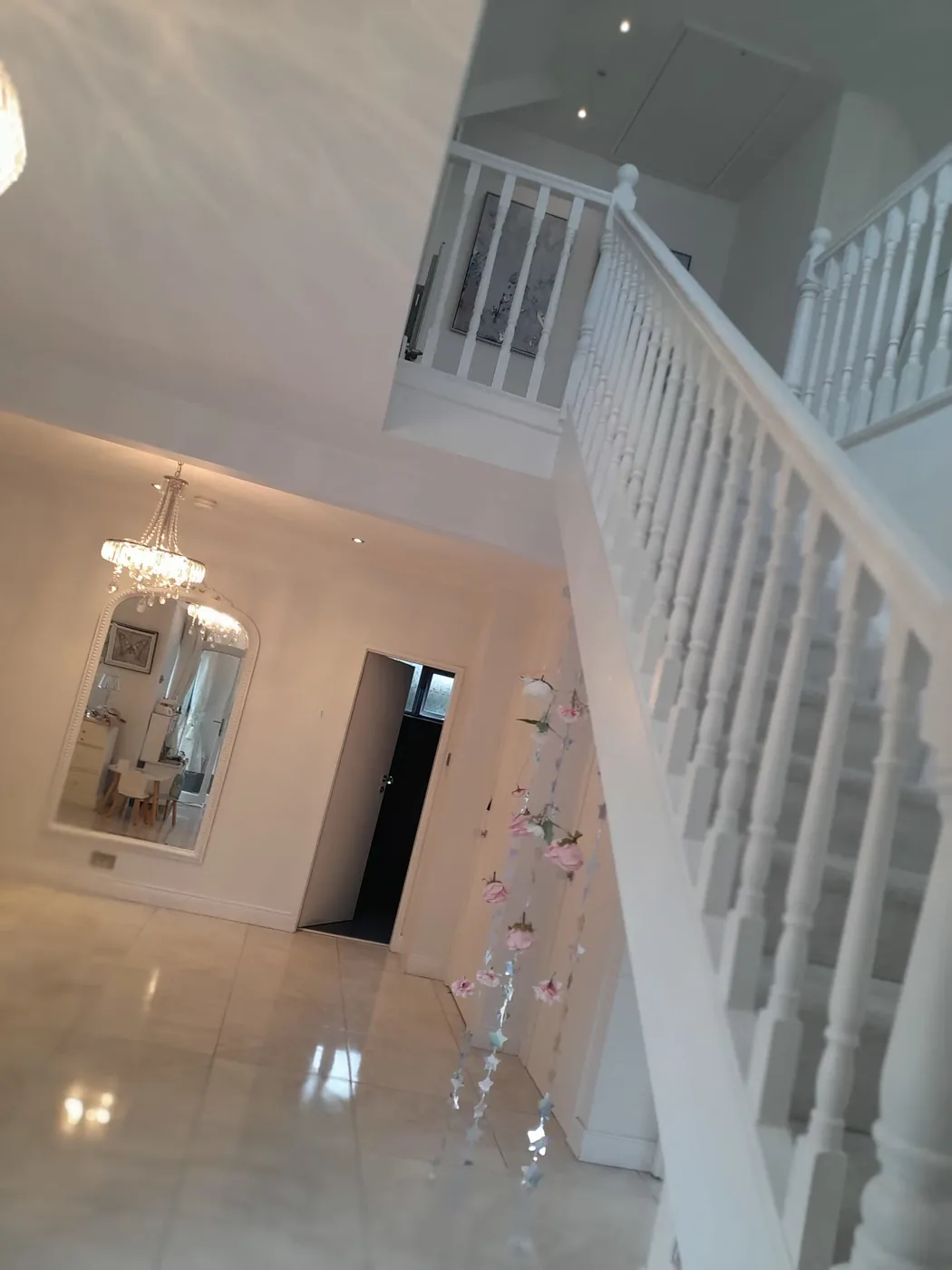 Bright, freshly cleaned hallway and staircase in a Greater Manchester home